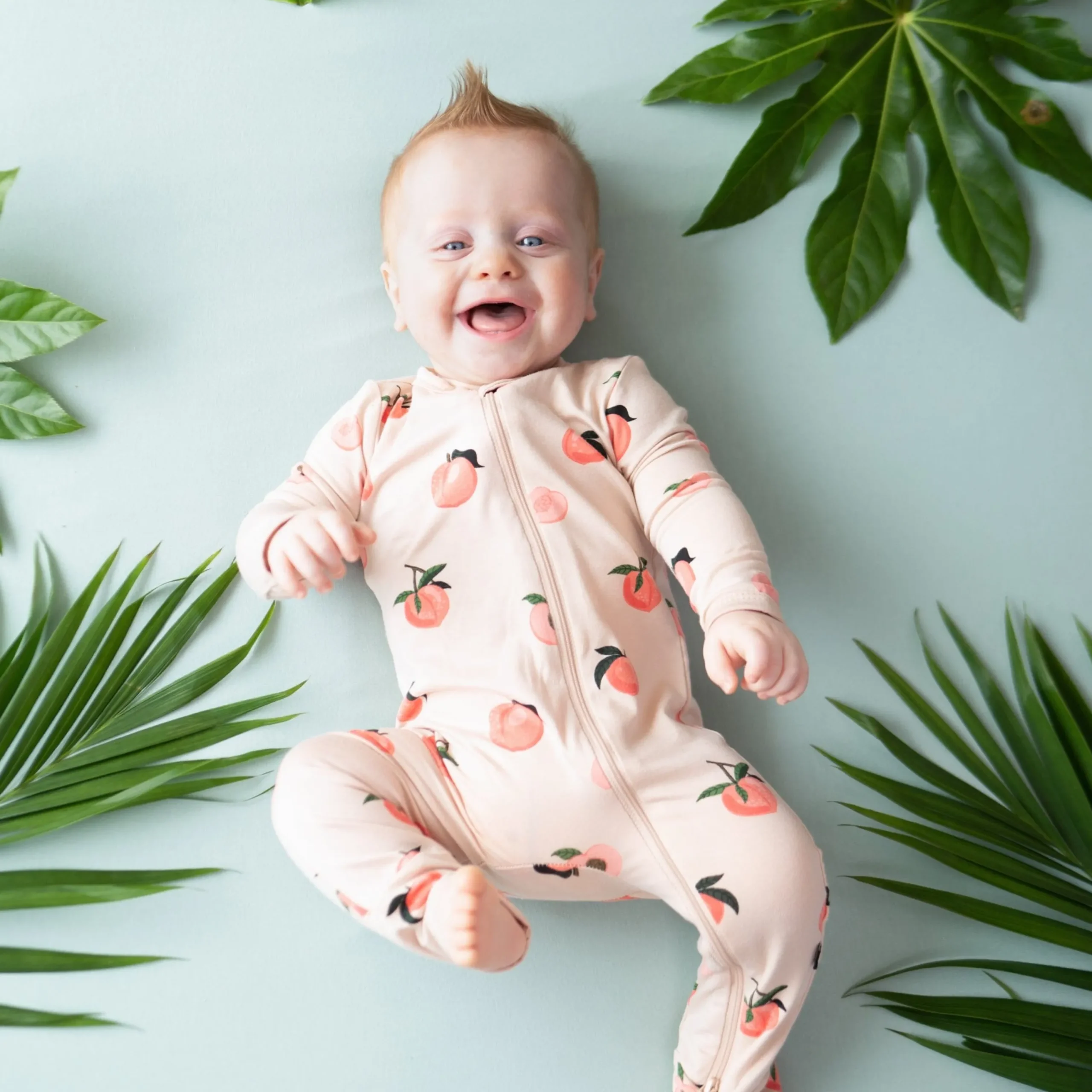 Kyte Baby Zippered Romper in Peach Online