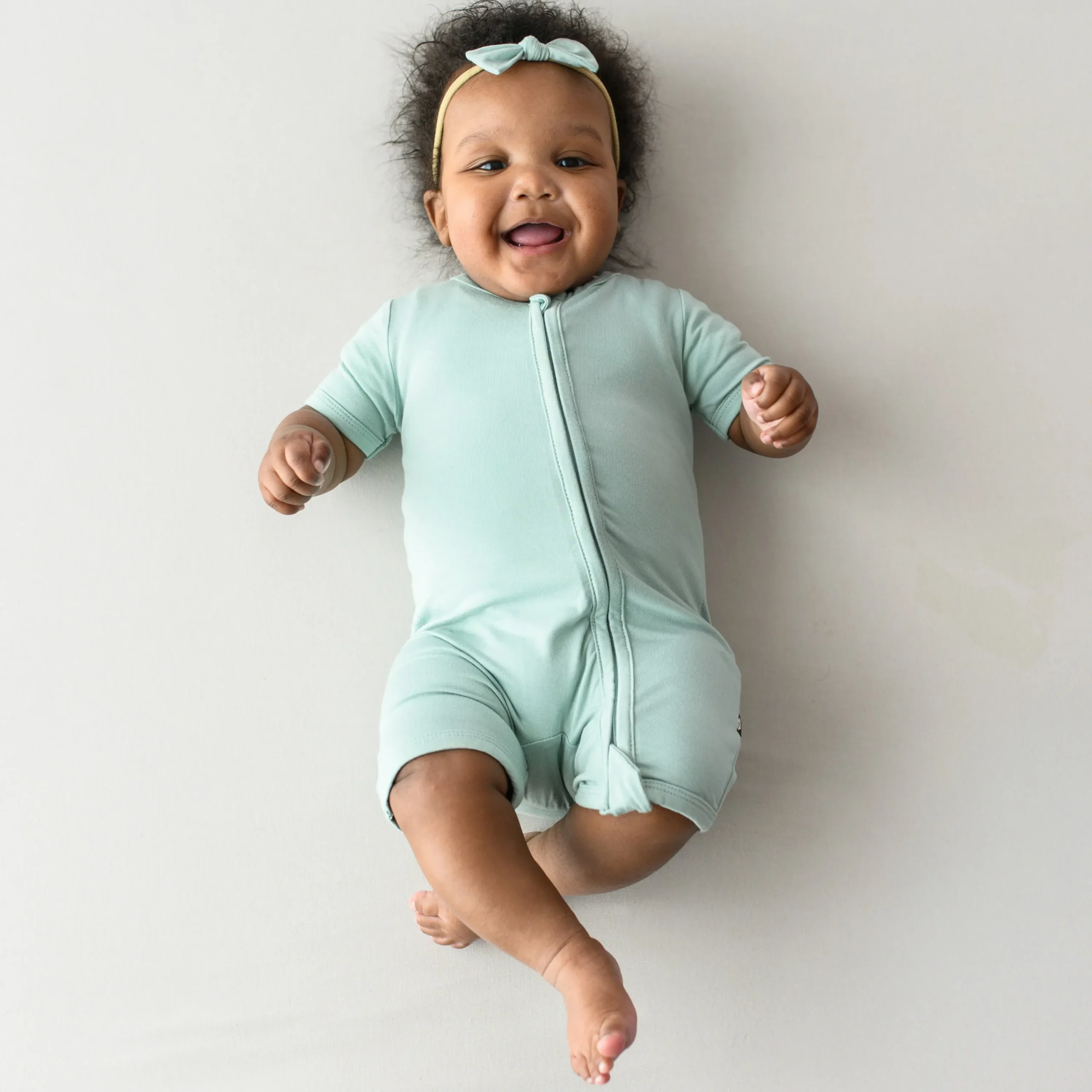 Kyte Baby Zippered Shortall Romper in Sage Clearance