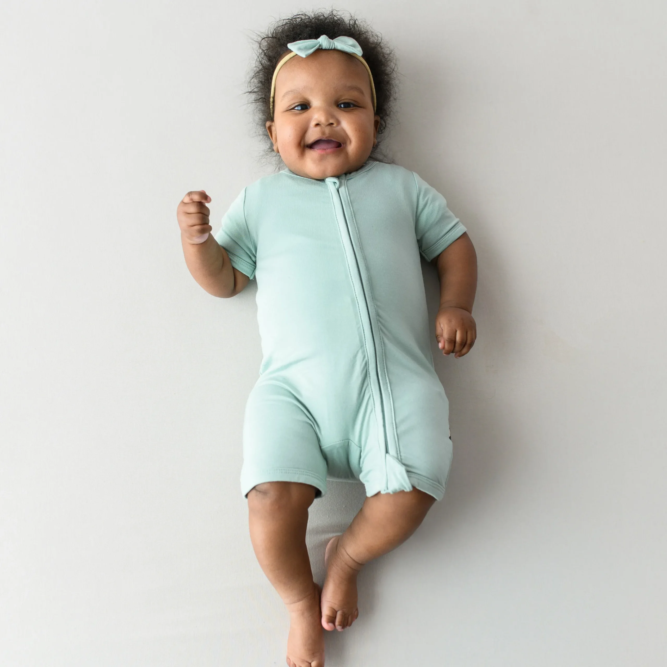 Kyte Baby Zippered Shortall Romper in Sage Clearance